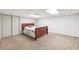 Cozy basement bedroom with a comfortable bed, carpeted floors, and white walls at 3501 Emperor Way, Tucker, GA 30084