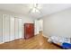 Bright, carpetless bedroom featuring twin bed and closet at 3501 Emperor Way, Tucker, GA 30084
