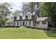 Charming two-story home with a well-manicured lawn and lush landscaping providing great curb appeal at 3501 Emperor Way, Tucker, GA 30084