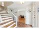 Welcoming foyer with hardwood floors and a staircase leading to the upper level at 3501 Emperor Way, Tucker, GA 30084