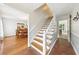 Spacious foyer featuring wood floors and a staircase offering access to other rooms at 3501 Emperor Way, Tucker, GA 30084