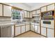 Efficient kitchen featuring bright white cabinetry, stainless appliances, and a functional layout at 3501 Emperor Way, Tucker, GA 30084