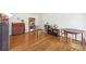 Bright living room with hardwood floors, a brick fireplace and comfortable seating at 3501 Emperor Way, Tucker, GA 30084