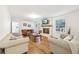 Bright living room featuring a brick fireplace, hardwood floors and comfortable furniture at 3501 Emperor Way, Tucker, GA 30084