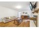 A comfortable living room offers hardwood floors, neutral decor, and fireplace, perfect for relaxing and entertaining at 3501 Emperor Way, Tucker, GA 30084