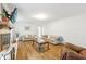 Bright living room with hardwood floors, fireplace, and neutral-toned sofas creates a cozy gathering space at 3501 Emperor Way, Tucker, GA 30084