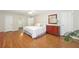 Spacious main bedroom with hardwood floors, ensuite bathroom, and classic furniture at 3501 Emperor Way, Tucker, GA 30084