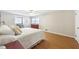 Bright main bedroom with hardwood floors, neutral walls, and natural light from the windows at 3501 Emperor Way, Tucker, GA 30084