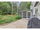 Cozy screened-in patio area with a grill, perfect for outdoor dining and entertaining at 3501 Emperor Way, Tucker, GA 30084