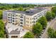 An aerial view showcases community with mature trees, offering an urban oasis at 870 Inman Village Pkwy # 203, Atlanta, GA 30307