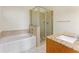 Bathroom with a tub, a glass-enclosed shower, and a granite-topped vanity at 870 Inman Village Pkwy # 203, Atlanta, GA 30307