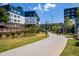 Scenic community pathway with modern apartment buildings and pedestrian overpass at 870 Inman Village Pkwy # 203, Atlanta, GA 30307