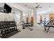 Well-equipped gym featuring weights, machines, mirrors, and a ceiling fan at 870 Inman Village Pkwy # 203, Atlanta, GA 30307