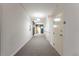 Long hallway with carpet and multiple doors to different units at 870 Inman Village Pkwy # 203, Atlanta, GA 30307