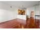 Spacious living room with hardwood floors opens to a modern kitchen, great for entertaining at 870 Inman Village Pkwy # 203, Atlanta, GA 30307