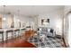 Stylish living room with adjacent kitchen and hardwood floors, and modern decor at 870 Inman Village Pkwy # 203, Atlanta, GA 30307