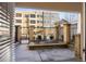 Patio with view of apartments behind a decorative black iron fence at 870 Inman Village Pkwy # 203, Atlanta, GA 30307