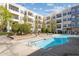 Community pool with surrounding patio, comfortable seating, and apartment buildings at 870 Inman Village Pkwy # 203, Atlanta, GA 30307