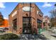 Charming brick restaurant with outdoor seating and large storefront windows at 870 Inman Village Pkwy # 203, Atlanta, GA 30307