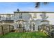 View of the rear exterior showing the fenced yard and back of the house at 115 Benfield Cir, Cartersville, GA 30121