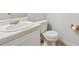 Neat, compact bathroom with white fixtures and simple decor at 115 Benfield Cir, Cartersville, GA 30121