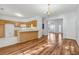 Dining room featuring hardwood floors, modern lighting, and views of the kitchen at 115 Benfield Cir, Cartersville, GA 30121