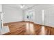 Bright living room featuring hardwood floors, white trim, and a bay window at 115 Benfield Cir, Cartersville, GA 30121