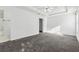 A bright primary bedroom boasts a tray ceiling and ensuite bathroom at 115 Benfield Cir, Cartersville, GA 30121