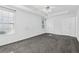 The primary bedroom features tray ceilings, fan and neutral carpeting at 115 Benfield Cir, Cartersville, GA 30121