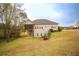 Large backyard with a screened-in porch and ample space for outdoor activities at 118 Jasmine Way, Carrollton, GA 30180