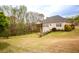 Spacious backyard with mature trees and lush greenery at 118 Jasmine Way, Carrollton, GA 30180