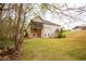 Expansive backyard featuring a screened-in porch perfect for outdoor entertaining at 118 Jasmine Way, Carrollton, GA 30180