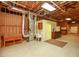 Large unfinished basement featuring open ceilings, concrete floors, and utility connections at 118 Jasmine Way, Carrollton, GA 30180