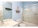 Nautical themed bathroom with vanity sink, tub with shower and decorative anchor art at 118 Jasmine Way, Carrollton, GA 30180