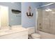Nautical themed bathroom with vanity sink, tub with shower and decorative anchor art at 118 Jasmine Way, Carrollton, GA 30180