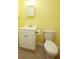 Bright bathroom with a neutral color scheme, a toilet, a sink with vanity, and tiled floors at 118 Jasmine Way, Carrollton, GA 30180