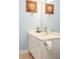 Bathroom vanity with compass themed decorations, bright lighting, and a mirror at 118 Jasmine Way, Carrollton, GA 30180
