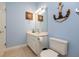 Nautical themed bathroom with vanity sink, toilet and decorative anchor art at 118 Jasmine Way, Carrollton, GA 30180
