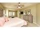 Spacious bedroom boasts a tray ceiling and a sitting area with matching decor at 118 Jasmine Way, Carrollton, GA 30180