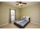 Simple bedroom with neutral colors, a window, and comfortable decor at 118 Jasmine Way, Carrollton, GA 30180