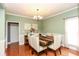Bright dining room with hardwood floors and elegant chandelier at 118 Jasmine Way, Carrollton, GA 30180