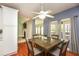Cozy dining room features a modern ceiling fan and natural light at 118 Jasmine Way, Carrollton, GA 30180