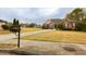 Well-kept single-Gathering home boasting a lush front lawn and a private driveway at 118 Jasmine Way, Carrollton, GA 30180