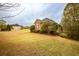 Lovely brick house with mature trees and landscaping set on a vast lawn at 118 Jasmine Way, Carrollton, GA 30180