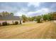 Home offers a serene suburban setting with a spacious lawn and well-maintained landscape at 118 Jasmine Way, Carrollton, GA 30180