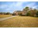 Attractive home on a large lot, showcasing a well-manicured lawn and established landscaping at 118 Jasmine Way, Carrollton, GA 30180