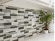 Stylish tile backsplash complements the kitchen's quartz countertops at 118 Jasmine Way, Carrollton, GA 30180