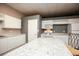 Bright kitchen featuring white cabinets, countertops, and appliances at 118 Jasmine Way, Carrollton, GA 30180