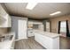 Well-equipped kitchen with white cabinetry and granite countertops at 118 Jasmine Way, Carrollton, GA 30180