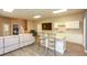 Inviting living room with a kitchen, island with seating, and a cozy couch at 118 Jasmine Way, Carrollton, GA 30180